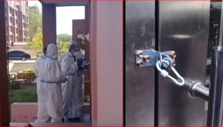 大陆防疫人员在焊接单元楼铁门