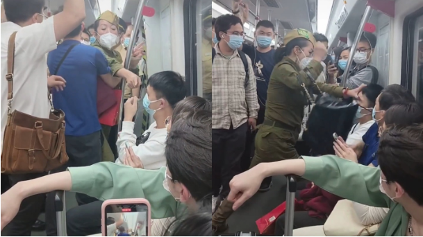 广州地铁上，一女子打人。